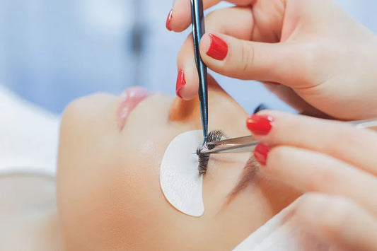 A woman is getting eyelash extensions